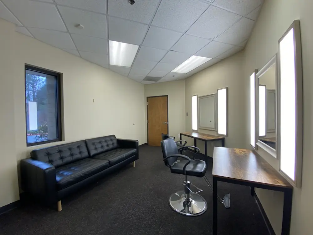 Green room with makeup station and talent lounge at Studio Space Atlanta West