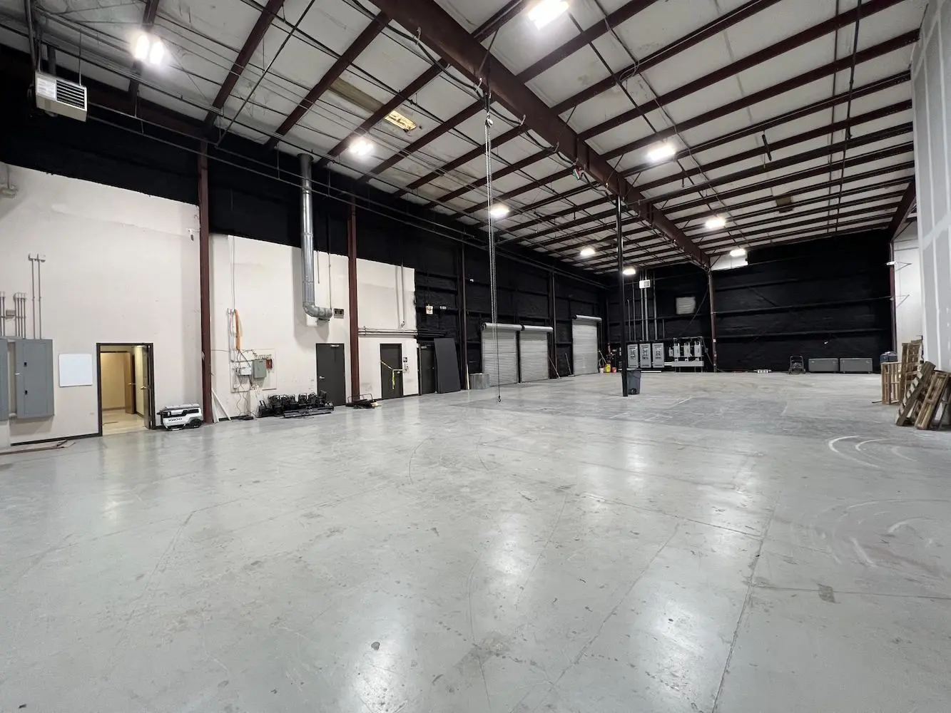 Stage 6 mill area with roll-up doors and production infrastructure