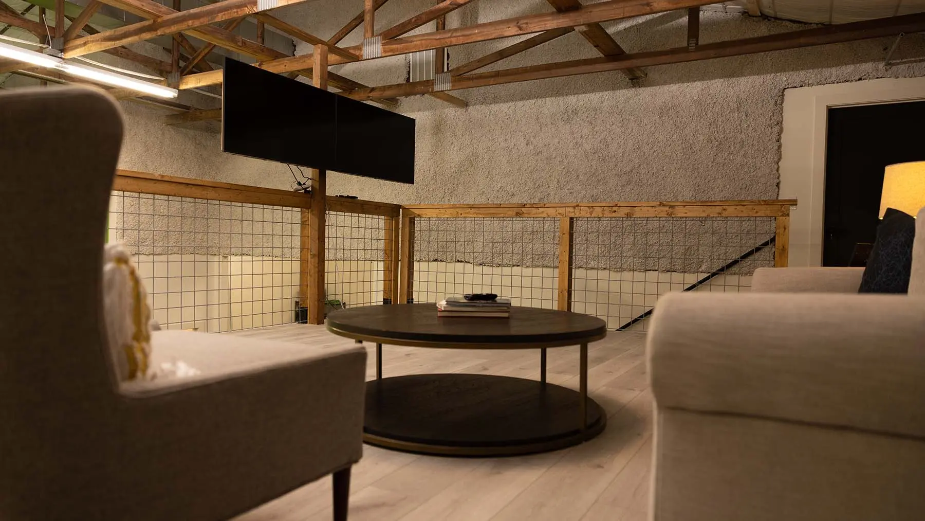 Client lounge seating area with monitor