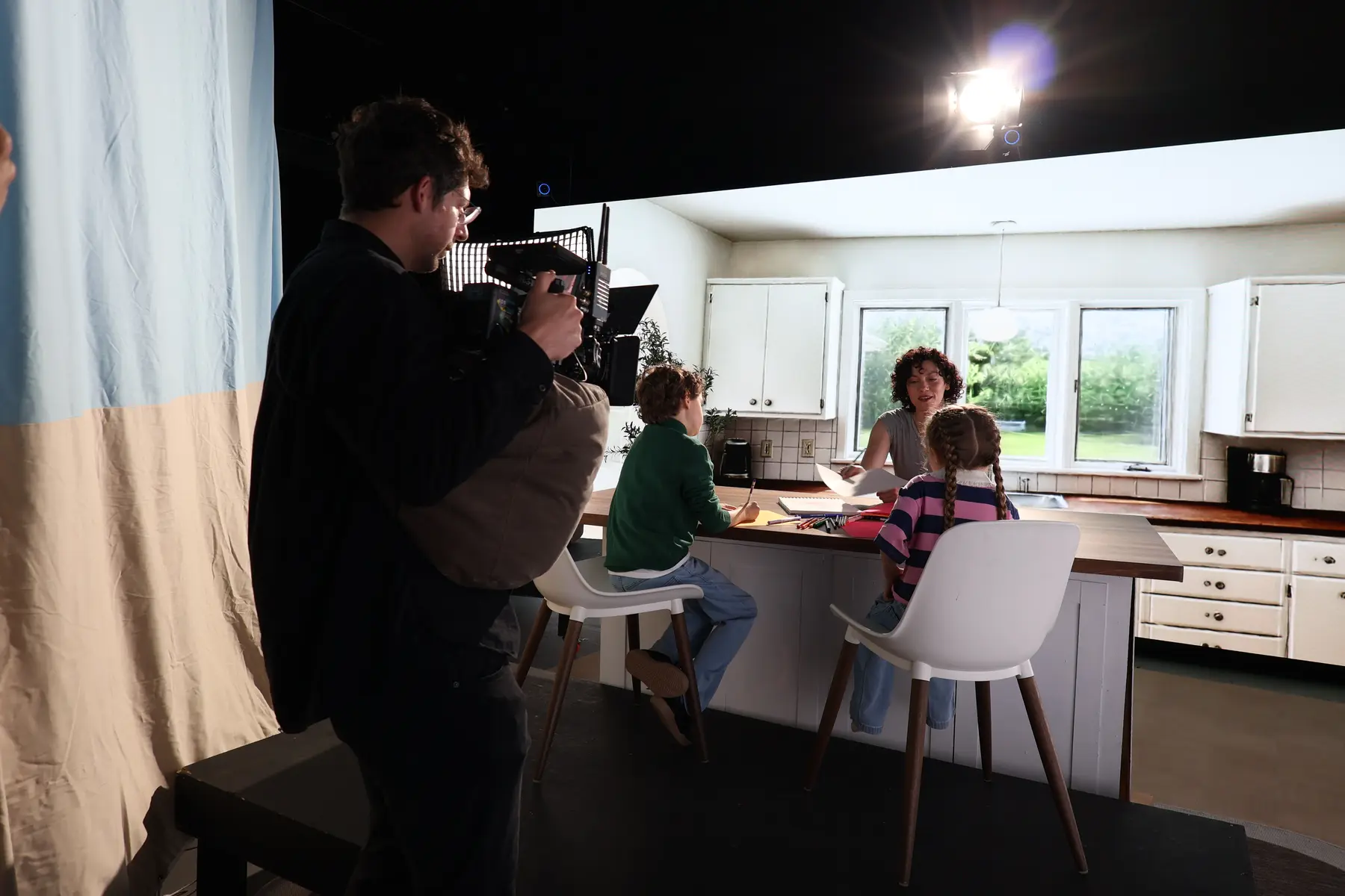 DP filming talent in virtual kitchen environment
